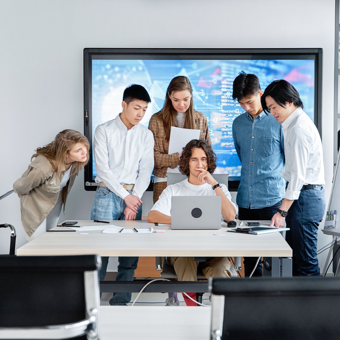 The Indivex team reviewing work together